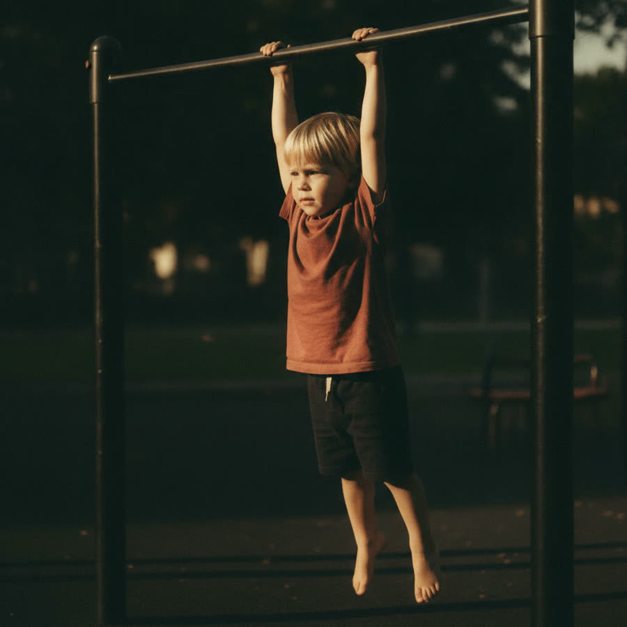 A child in a full dead hang